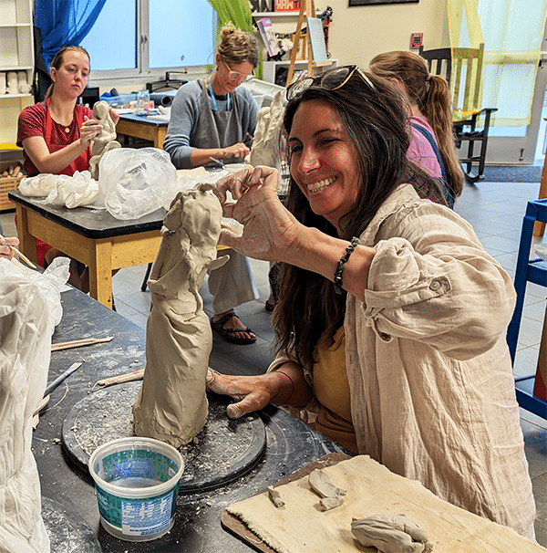 Student working with clay